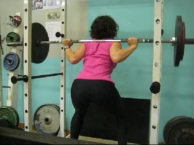 Gubernatrix squatting in a power rack