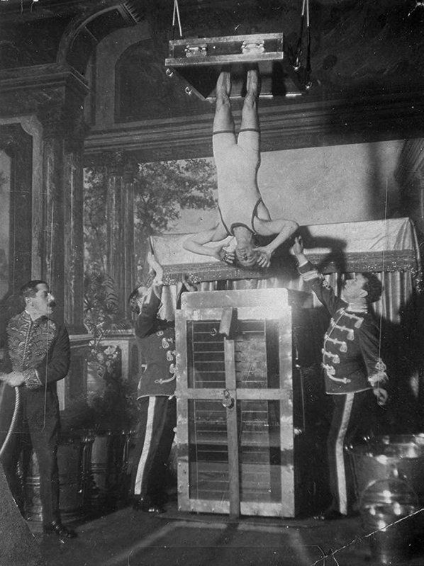 Harry Houdini's Chinese Water Torture Cell, In this trick, Houdini was to escape an extraordinary contraption resembling a fish tank. This is filled with water while Houdini is placed head down, in full view of the audience. His feet are manacled and when the tank is covered it is difficult to imagine how he can possibly escape.
