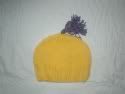 Hats on the bed!  Toddler/Pre-school Yellow Hat w/ Purple Puff