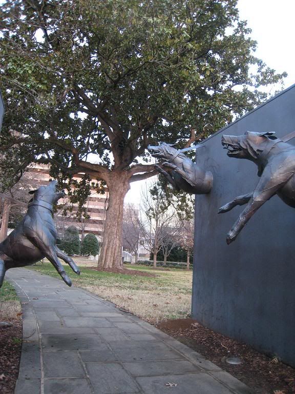 statue depicts attack dogs forced on demonstrators