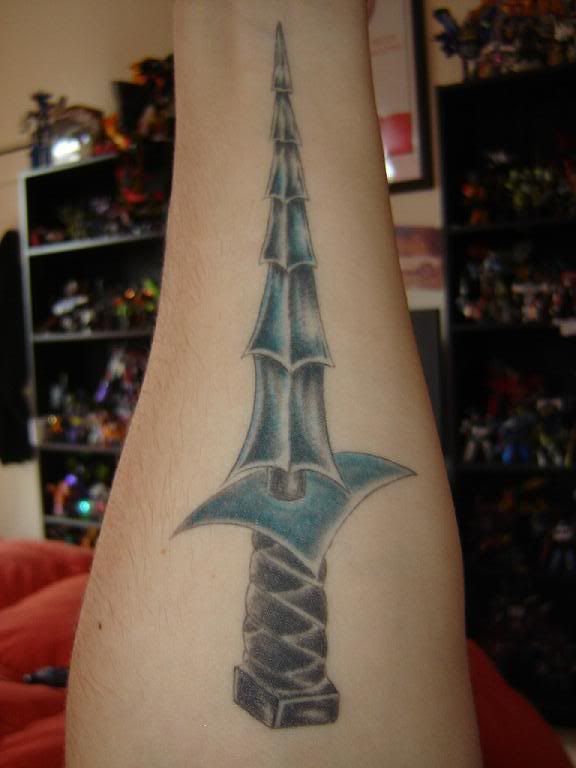 Dinobots sword tattoo