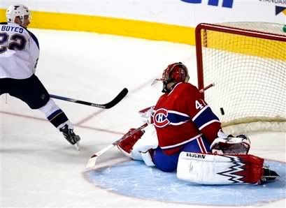 Keep turning your head Halak, Brad Boyes put the puck behind you.