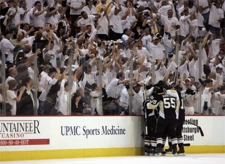 The fans cheering the guys in black wore white. Makes perfect sense.